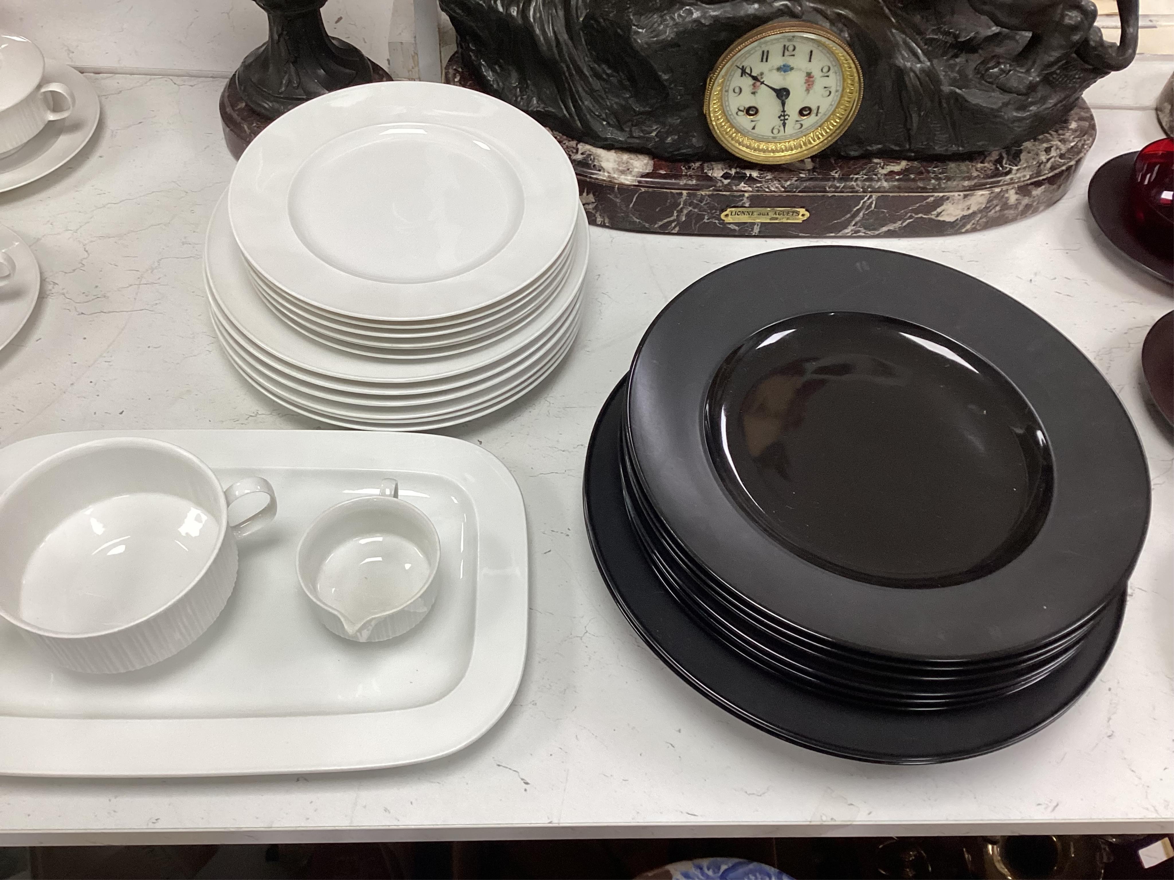 A Wirkkala for Rosenthal part dinner set to include a set of dinner plates, two tureens and six ruby glass bowls, largest 33cm in diameter